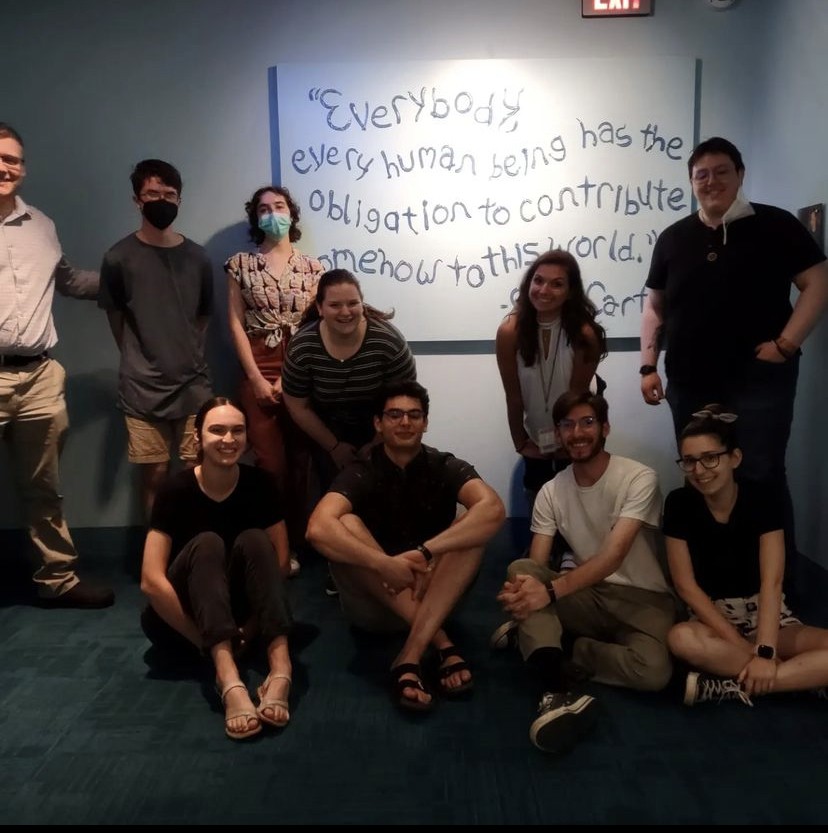 Group in front of motivational quote sign