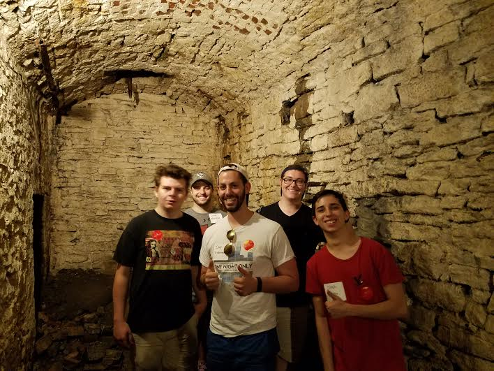 students in an underground cave