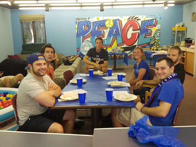 students sitting at a table after having a meal